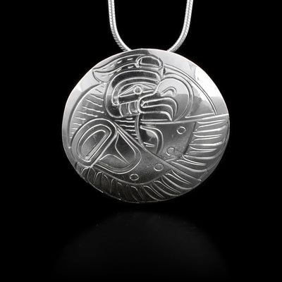 This sterling silver pendant is oval shaped and has the Raven engraved onto it.