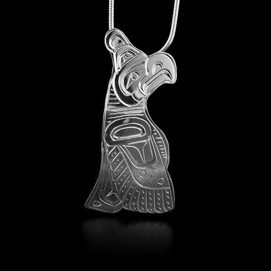 This sterling silver Thunderbird pendant is shaped like the Thunderbird and has engravings that depict the Thunderbird.
