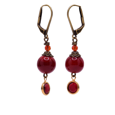 Brass dangle earrings with red handmade lampworked glass beads and crystals.