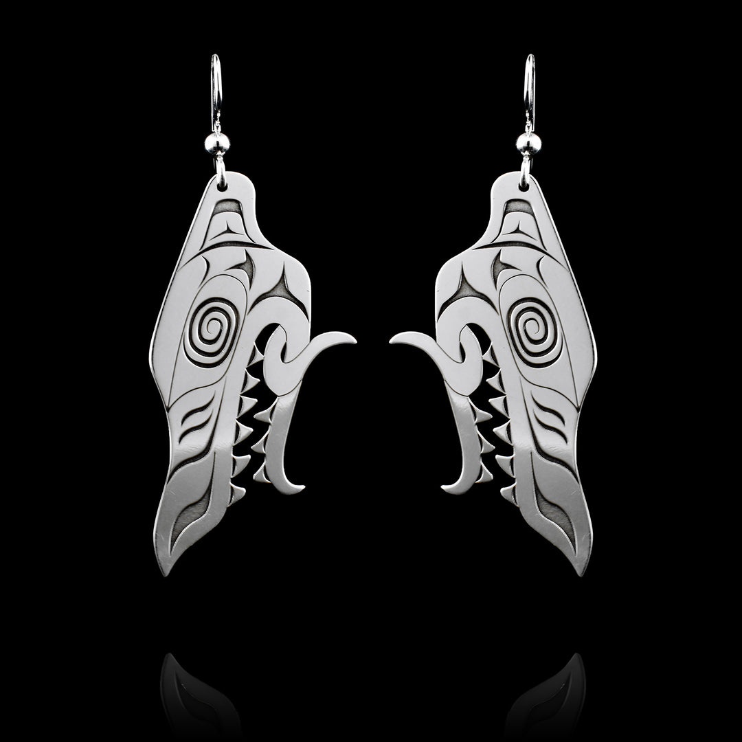 Made with sterling silver these Wolf Head Dangle Earrings are uniquely carved with a lot of detail to the wolf's face. 
