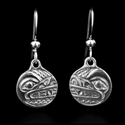 These sterling silver dangle earrings have small circle hangs with depictions of the Wolf carved into them.