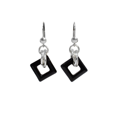 Jet black Swarovski crystal squares with thick sterling silver loops through them. Flange earring hooks.