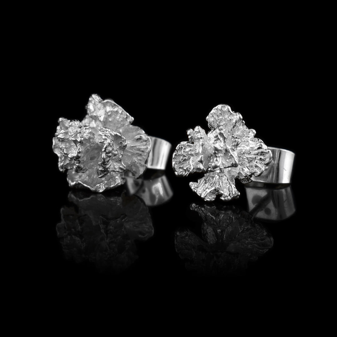 These cedar pinecone earrings studs are made using sterling silver and depict realistic cedar tree pinecones.