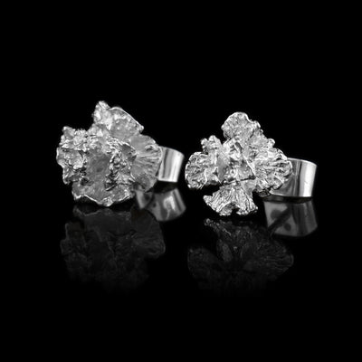 These cedar pinecone earrings studs are made using sterling silver and depict realistic cedar tree pinecones.