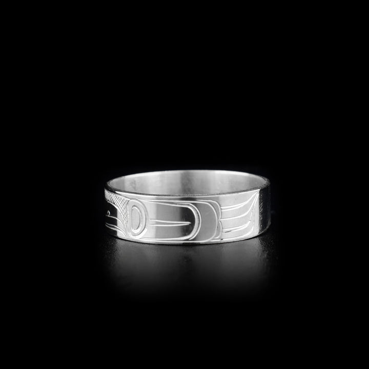 This Eagle ring has the profile of an eagle's head facing the right. On both sides are carved designs representing the wings and body of the eagle.