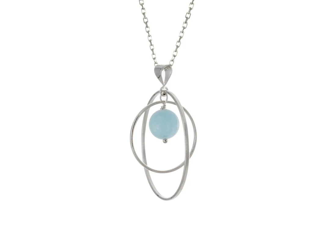 This aquamarine necklace has a large sterling silver hoop with a smaller hoop in the middle of it and a sphere shaped aquamarine bead in the center of them. All of these pieces are suspended and can orbit around each other.