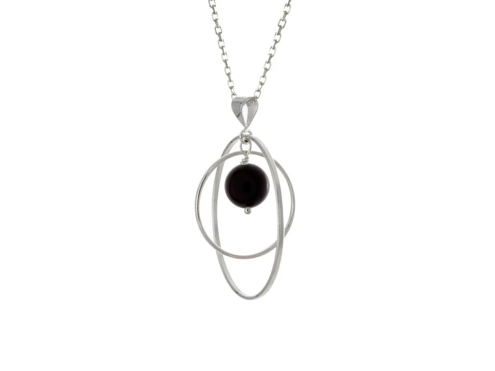 This black onyx necklace has a large sterling silver hoop with a smaller hoop in the middle of it and a sphere shaped black onyx bead in the center of them. All of these pieces are suspended and can orbit around each other.
