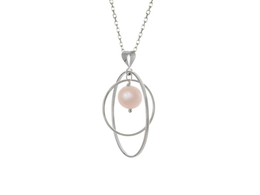 This pink pearl necklace has a large sterling silver hoop with a smaller hoop in the middle of it and a sphere shaped pink pearl bead in the center of them. All of these pieces are suspended and can orbit around each other.