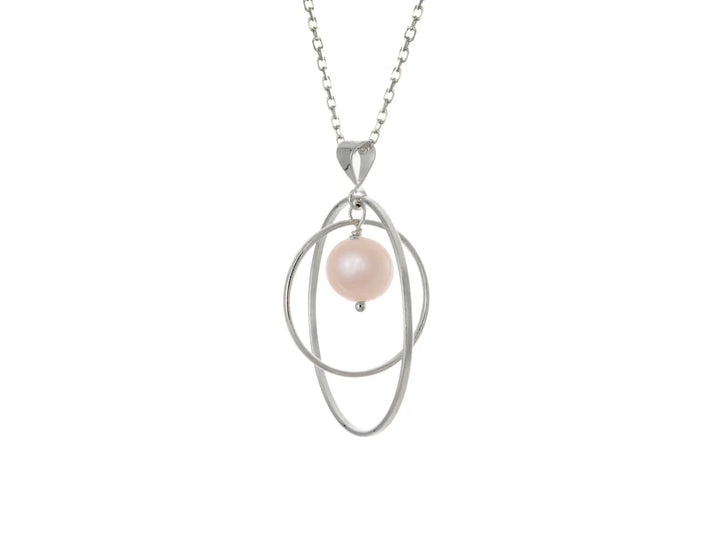 This pink pearl necklace has a large sterling silver hoop with a smaller hoop in the middle of it and a sphere shaped pink pearl bead in the center of them. All of these pieces are suspended and can orbit around each other.