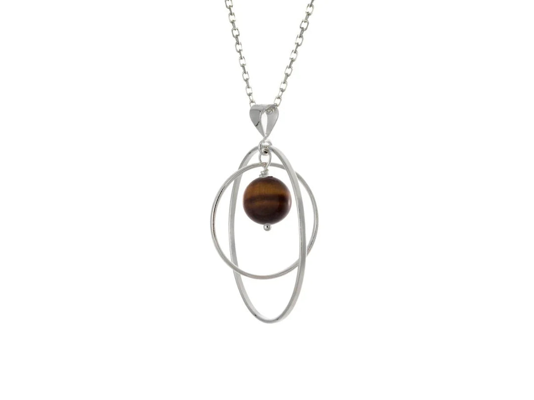 This tiger's eye necklace has a large sterling silver hoop with a smaller hoop in the middle of it and a sphere shaped tiger's eye bead in the center of them. All of these pieces are suspended and can orbit around each other.