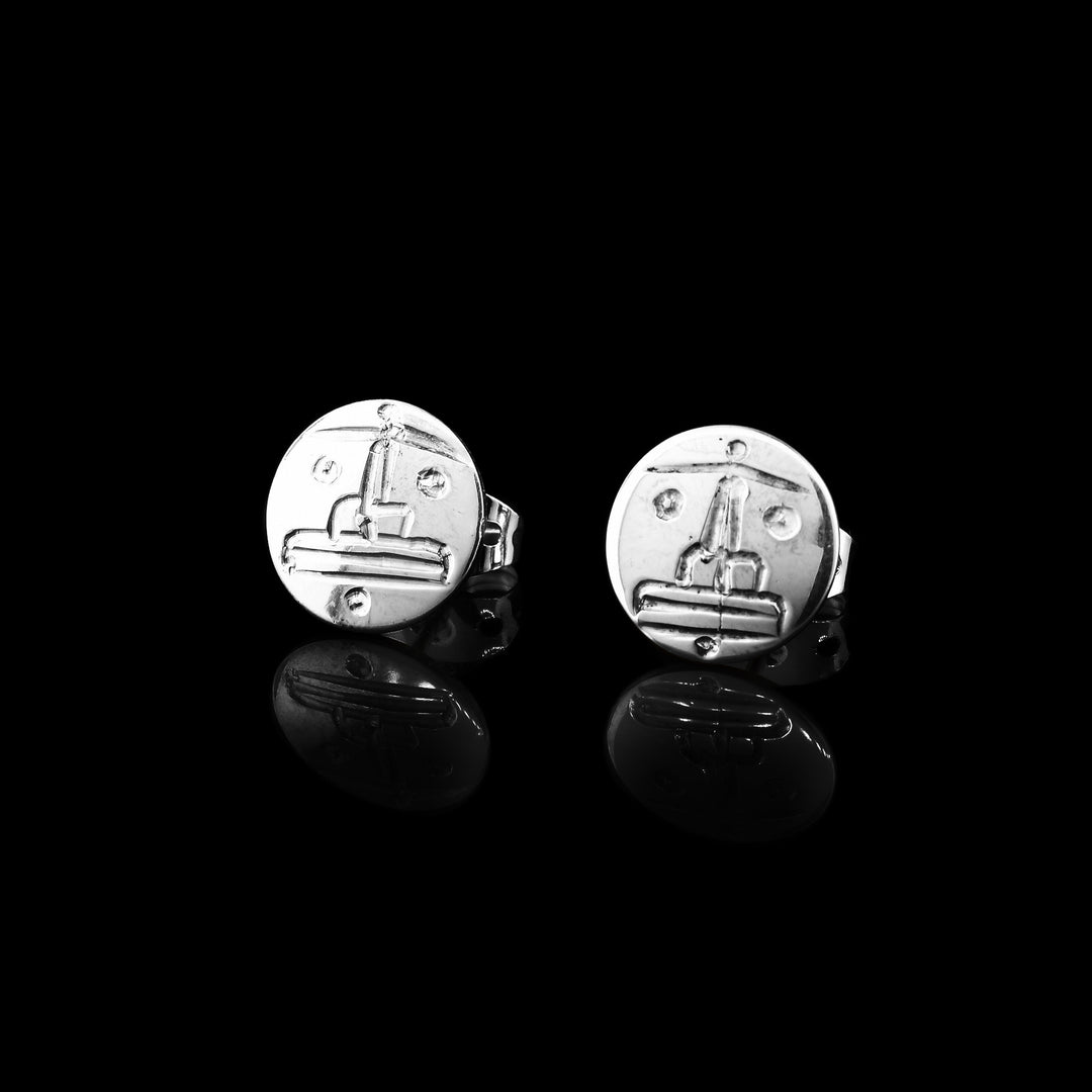 These sterling silver studs are hand carved with the face of the legend if the sun