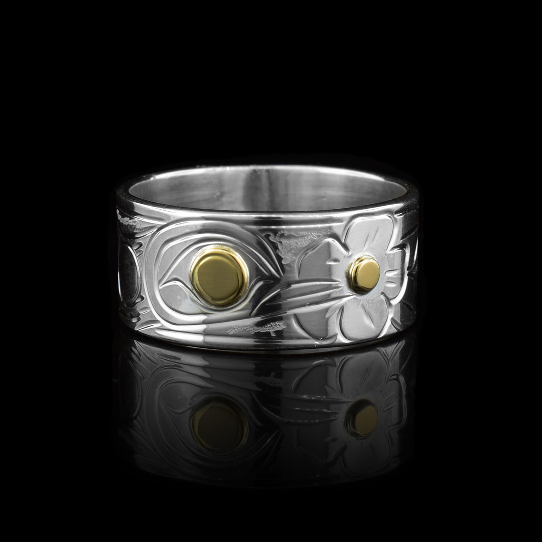 This sterling silver 14k gold hummingbird band ring is hand-carved with elegant detail of the hummingbird legend. The 14k gold is used for the eye of the bird, and the middle of the flower it is drinking from.