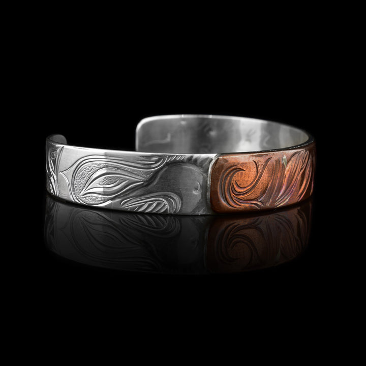 three-tiered meaning from three different indiginous legends. The Egale, Moon and Orca.