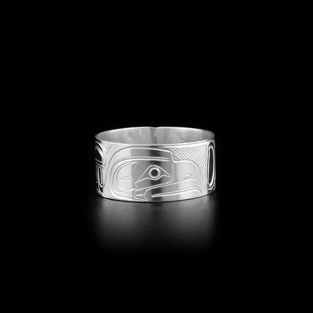 This Eagle ring is made from sterling silver and has a wide band. There is a depiction of the Eagle carved into the surface of the band.
