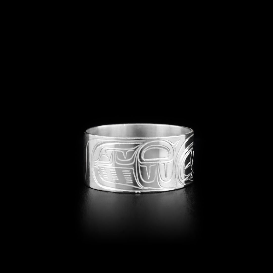 This Eagle ring is made from sterling silver and has a wide band. There is a depiction of the Eagle carved into the surface of the band.