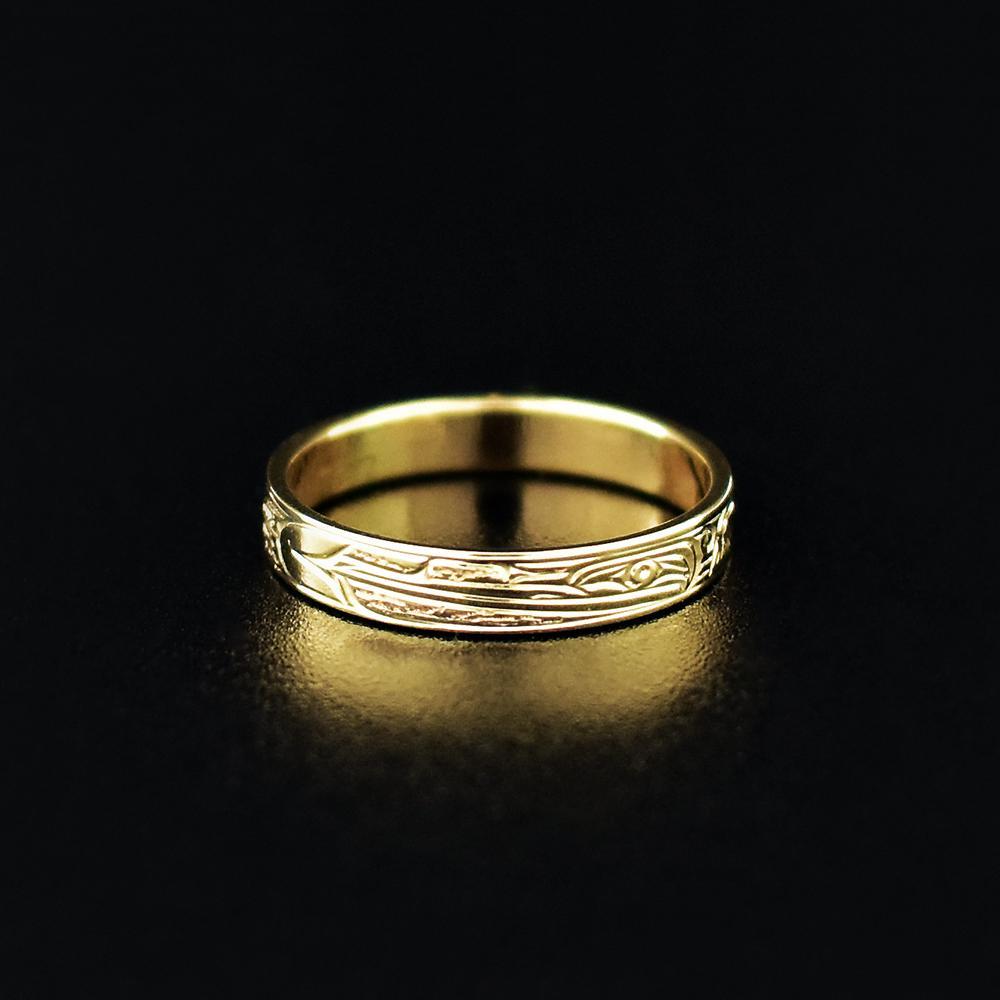 This dainty Hummingbird ring is made from 14K gold and has a single, thin band. There is a elegant depictions of the Hummingbird carved into the surface of the band.