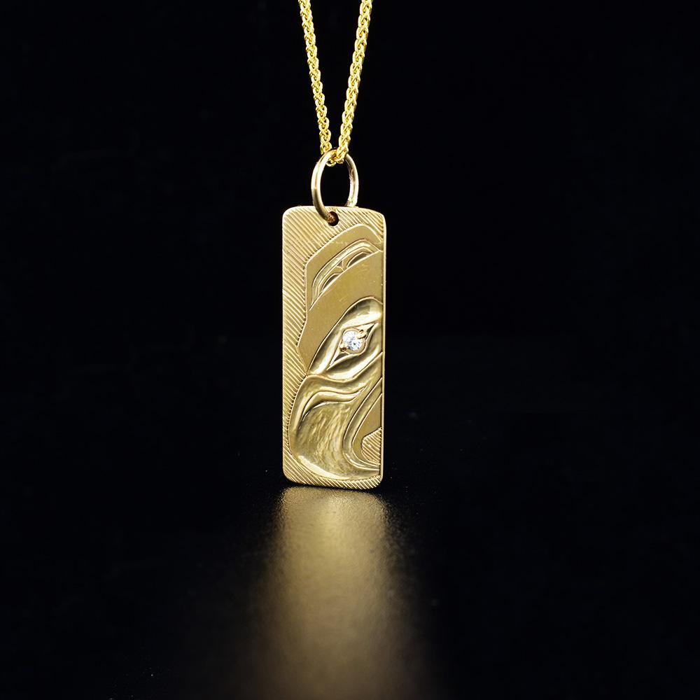 14k gold eagle pendant with diamond eye, hand carved