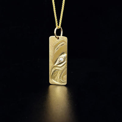 14k gold eagle pendant with diamond eye, hand carved