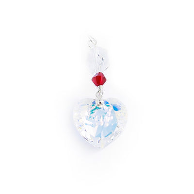 This Swarovski Crystal Heart Pendant is handcrafted by artist Debra Nelson. She has used Sterling silver and Aurora Borealis Swarovski Crystal to create this piece. The pendant measures 1.50" x 0.55" including the bail.