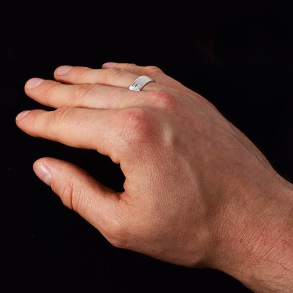 This heavy gauge sterling silver ring has a single band with a depiction of the Bear carved into the surface of it.