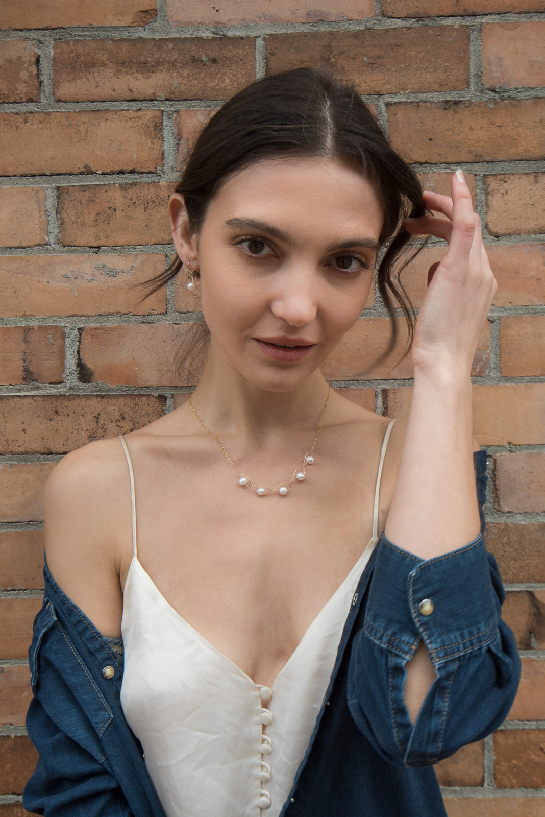 This filled gold chain necklace with pearls has been made by combining tear drop shaped links made from white freshwater pearls strung through gold fill wire. These links are connected to form this pearl, chain link necklace.