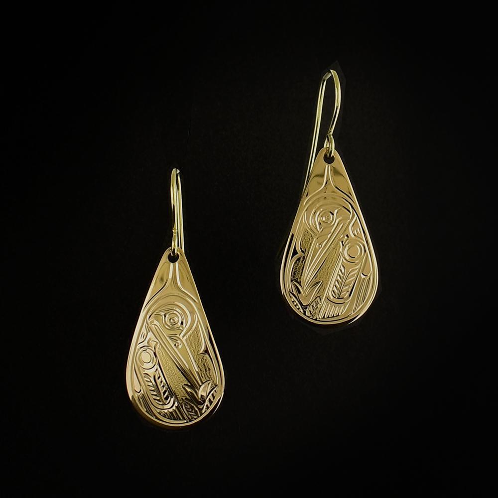 These Hummingbird earrings are made from 14K gold and have teardrop shaped hangs. There are depictions of the Hummingbird carved into the surface of the hangs.