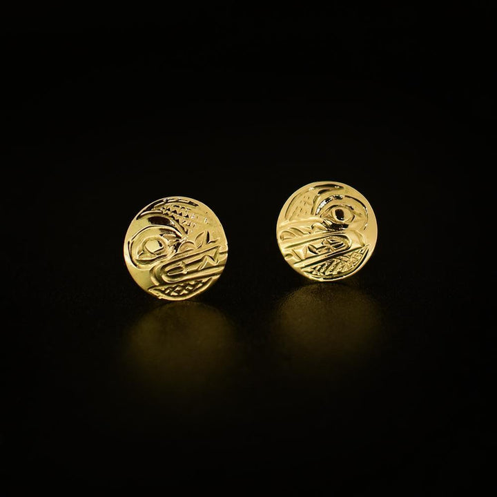 These Wolf earrings are made from 14K gold and are small and circle shaped. There are depictions of the Wolf carved into the surface of these stud earrings.