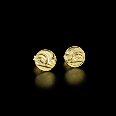 14K Gold Hummingbird Cast Studs by Carrie Matilpi. The design depicts the profile of a hummingbird's head facing towards one side with an open eye and small beak.