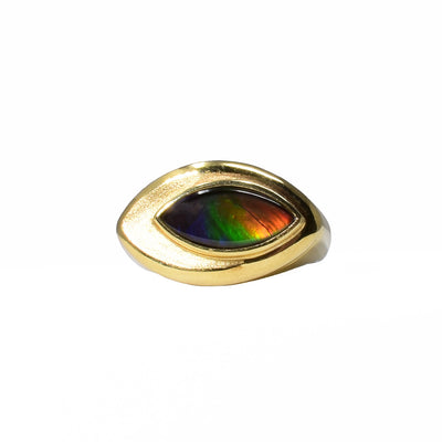 Unique ammolite eye signet ring by Korite. A piece of grade AA ammolite has been bezel set in a 14K gold signet ring. Stone shines a variety of lovely colours, featuring purple, blue, green, orange and red. Size 7.