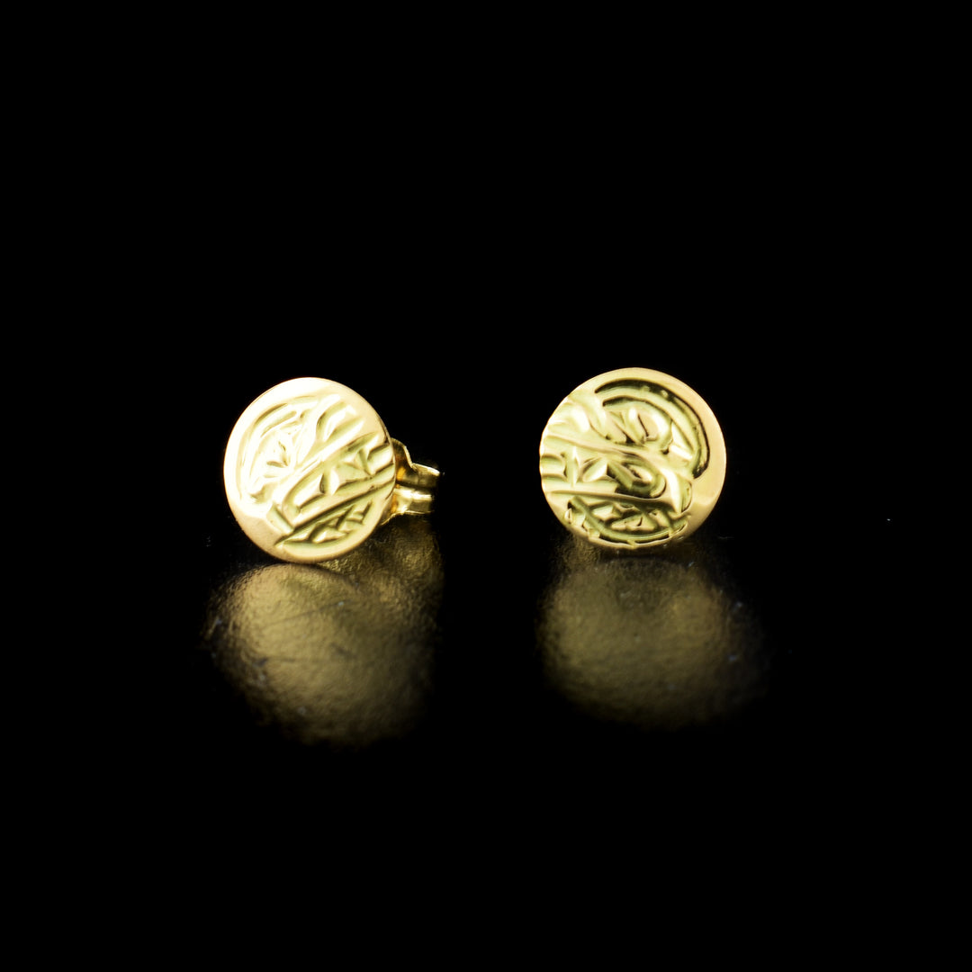 Bear stud earrings hand-carved by Kwakwaka'wakw artist Carrie Matilpi. Made of 14K gold. Each earring measures 0.25" in diameter.