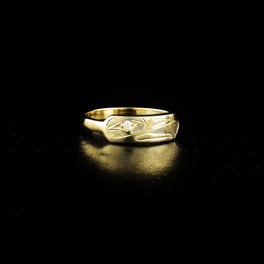 Eagle stacker ring hand-carved by Haisla artist Hollie Bartlett. She has used crosshatching to depict the face of an eagle with a diamond set in the eye. Size 6.75 available.