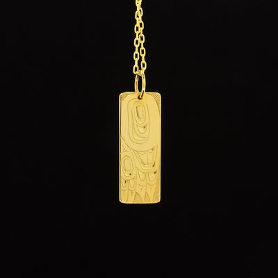 14K gold rectangular eagle wing pendant hand-carved by Indigenous artist Andrew Williams. Pendant is 1.25" x 0.38" with bail. Chain not included.