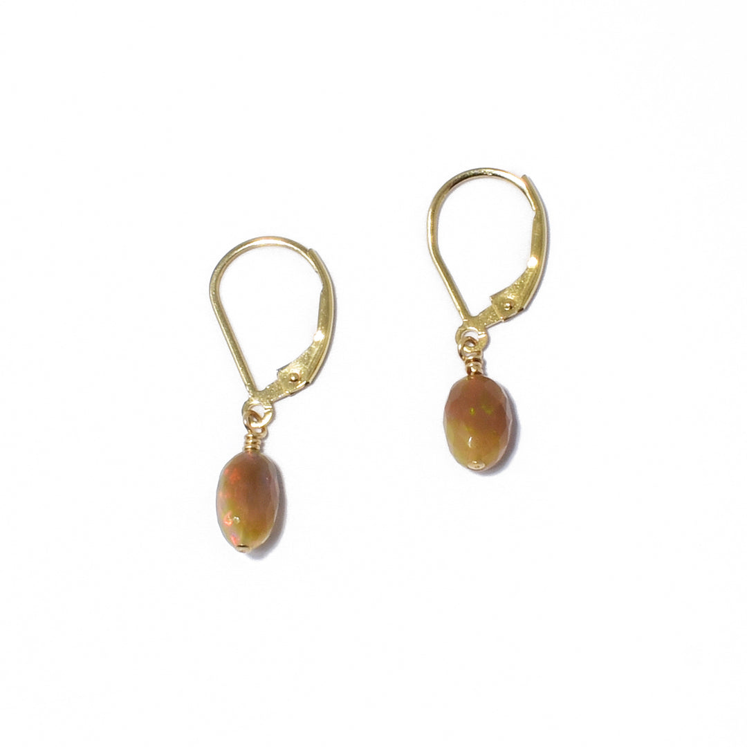 Dazzling lever back earrings handcrafted by artist Debra Nelson. Made of Ethiopian opal and 14K gold filled hooks and wire. Each earring measures 0.88" x 0.19" including hook.