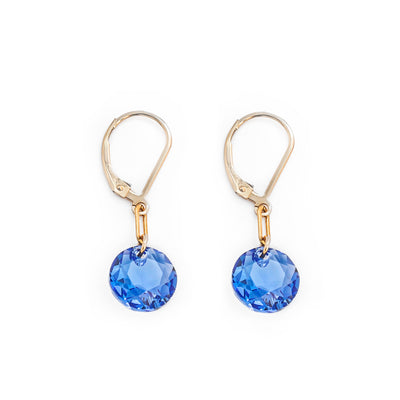 Stunning lever back earrings handcrafted by artist Debra Nelson. Made of blue Swarovski Crystal and 14K gold-filled links and ear hooks. Each earring measures 1.25" x 0.39" including hook.