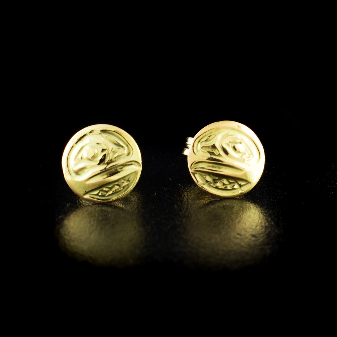 Raven stud earrings hand-carved by Kwakwaka'wakw artist Carrie Matilpi. Made of 14K gold. Each earring measures 0.25" in diameter.