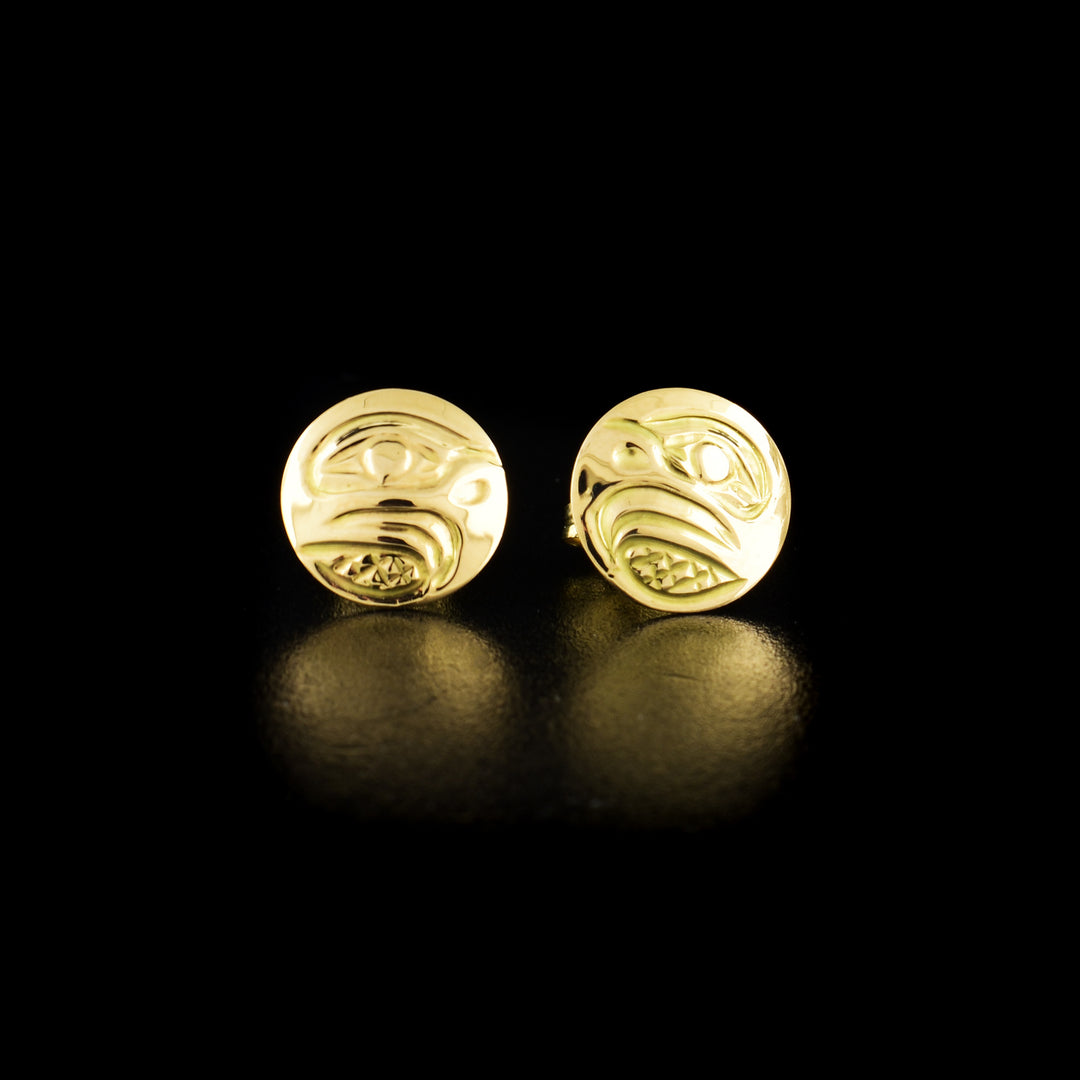 Eagle stud earrings hand-carved by Kwakwaka'wakw artist Carrie Matilpi. Made of 14K gold. Each earring is 0.38" in diameter.