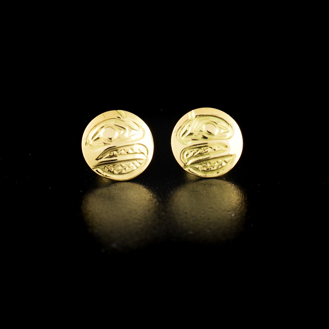 Raven stud earrings hand-carved by Kwakwaka'wakw artist Carrie Matilpi. Made of 14K gold. Each earring is 0.38" in diameter.