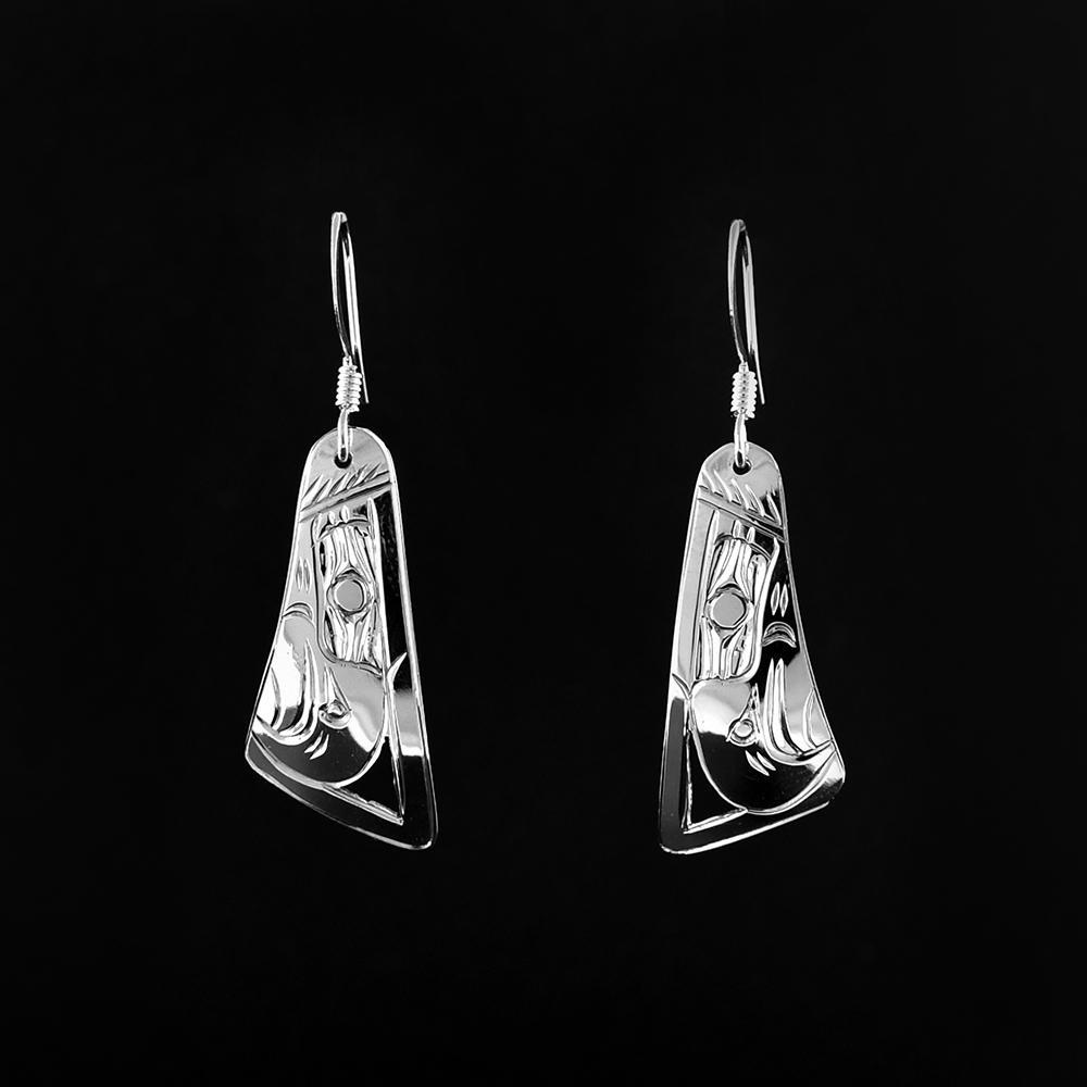 These funky Eagle earrings are made from sterling silver and have wide, tapered hangs. There are depictions of the Eagle carved into the surface of the hangs.