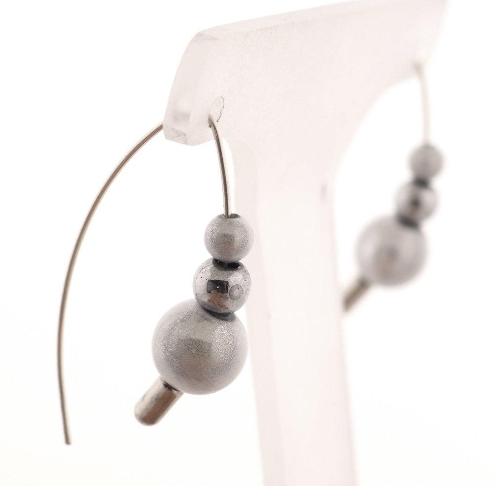 These stacker moon glow bead hoop earrings come with several colorful beads and hoops that you can customize with the beads.