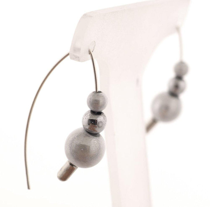 These stacker moon glow bead hoop earrings come with several colorful beads and hoops that you can customize with the beads.