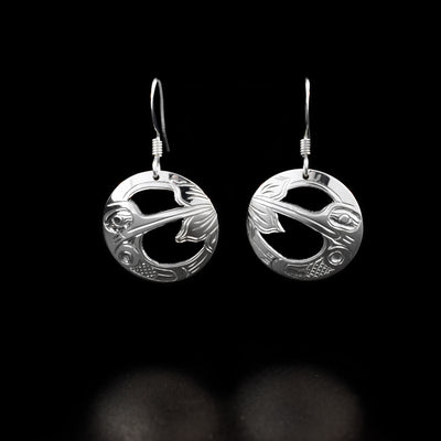 Sterling Silver Circle Hummingbird Earrings by Harold Alfred. The design in each earring depicts a hummingbird feeding from a flower with a wing in the lower part of the earring.