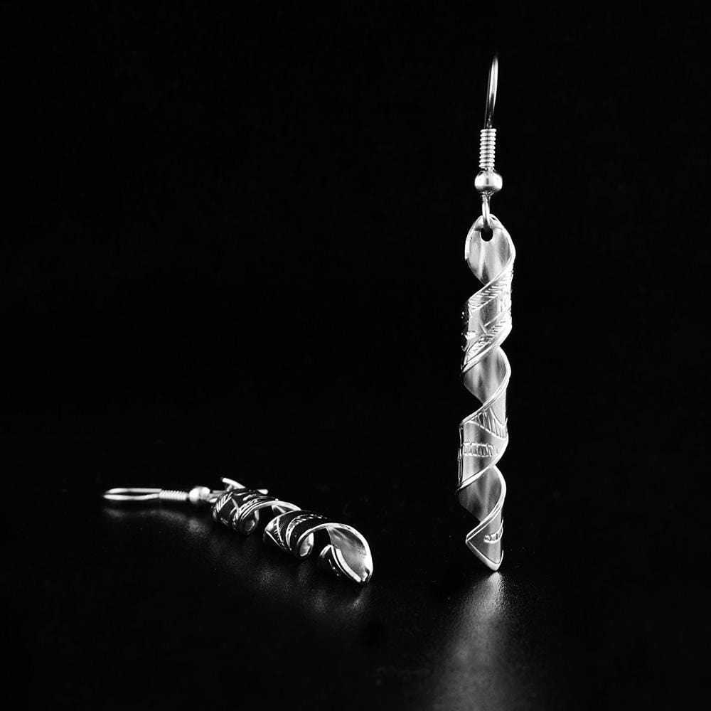 These dangling, spiral earrings are made from sterling silver and have long, thing hangs. The hangs are made from a band taht has been coiled into an elegant spiral. There are depictions of the Wolf that have been carved into the surface of the hangs.
