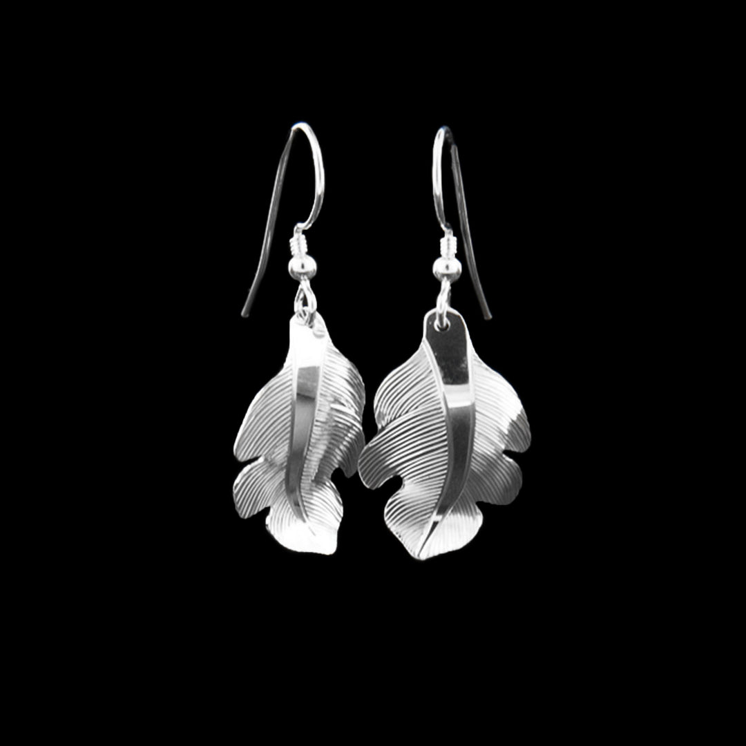 Sterling Silver Owl Feather Dangle Earrings by Fred Myra. This second photo shows the same earrings as the first in a different angle.