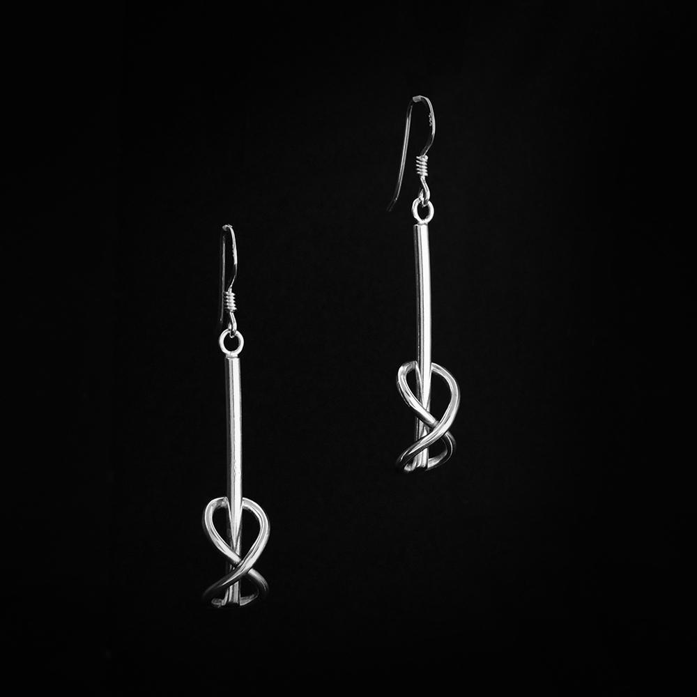These sterling silver drop earrings have a long wire going down with a vertical infinity sign made of wire at the end.