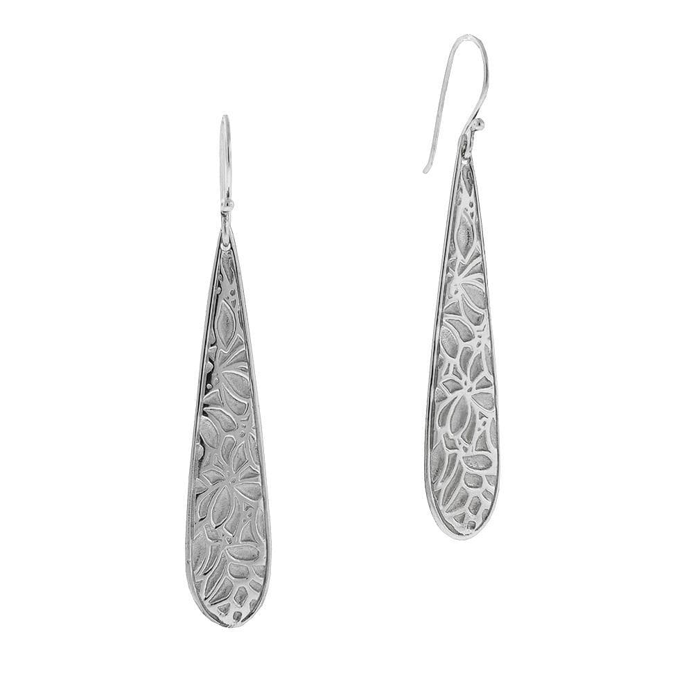 These sterling silve flower earrings have long, thin teardrop shaped hangs with textured flower patterns on the surface of it.