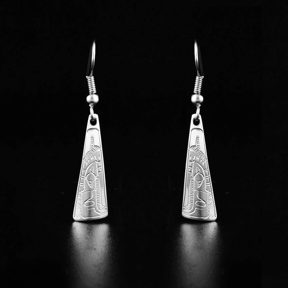 These eagle earrings have the profile of an eagle's head facing down at the bottom of each earring. There is a feather on the back of the eagle's head.
