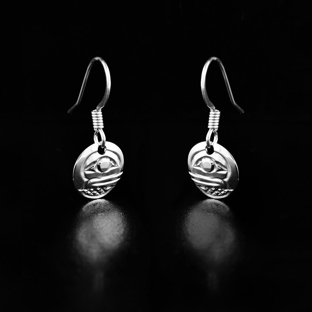 These sterling silver Orca earrings have small, circle hangs with depictions of the Orca cast into the surface of them.