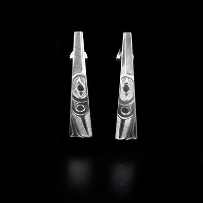 These Sterling Silver Tapered Hummingbird Post Earrings are hand-carved by Haisla artist, Hollie Bartlett.  She has used crosshatching to depict the face of a hummingbird on each earring.  Each earring measures 1.45" x 0.25".     The Hummingbird Legend Represents: BEAUTY, LOVE, HARMONY.