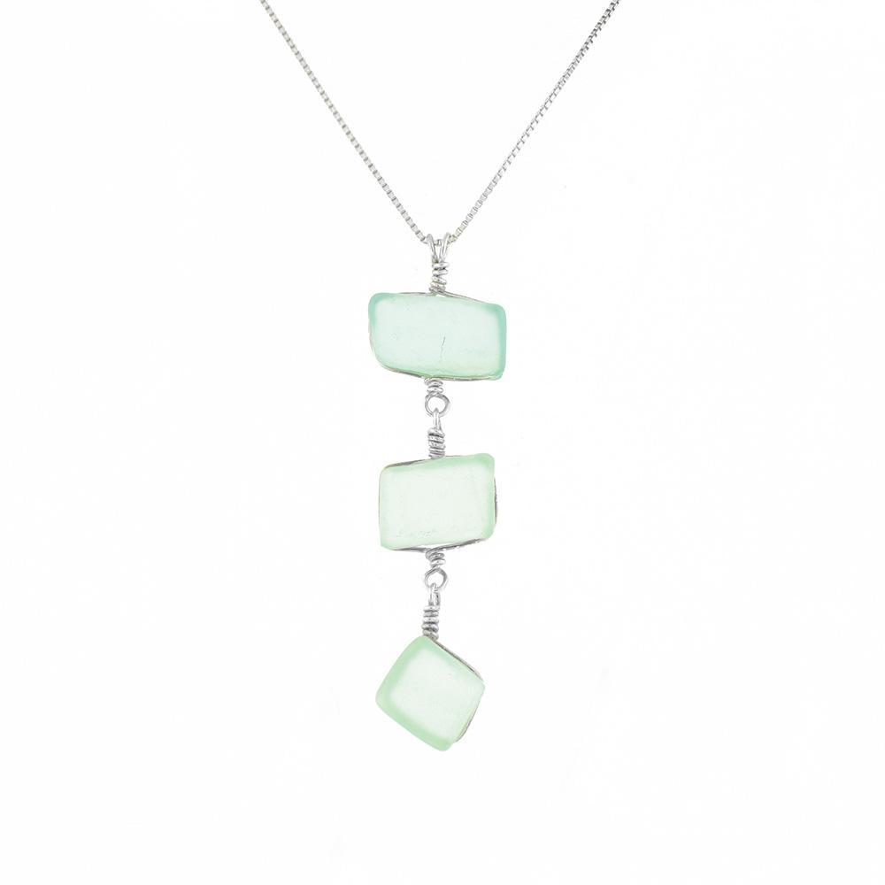 This sea glass pendant necklace is made from sterling silver and sea glass. It has a pendant made a three pieces of sea glass hanging from eachother.