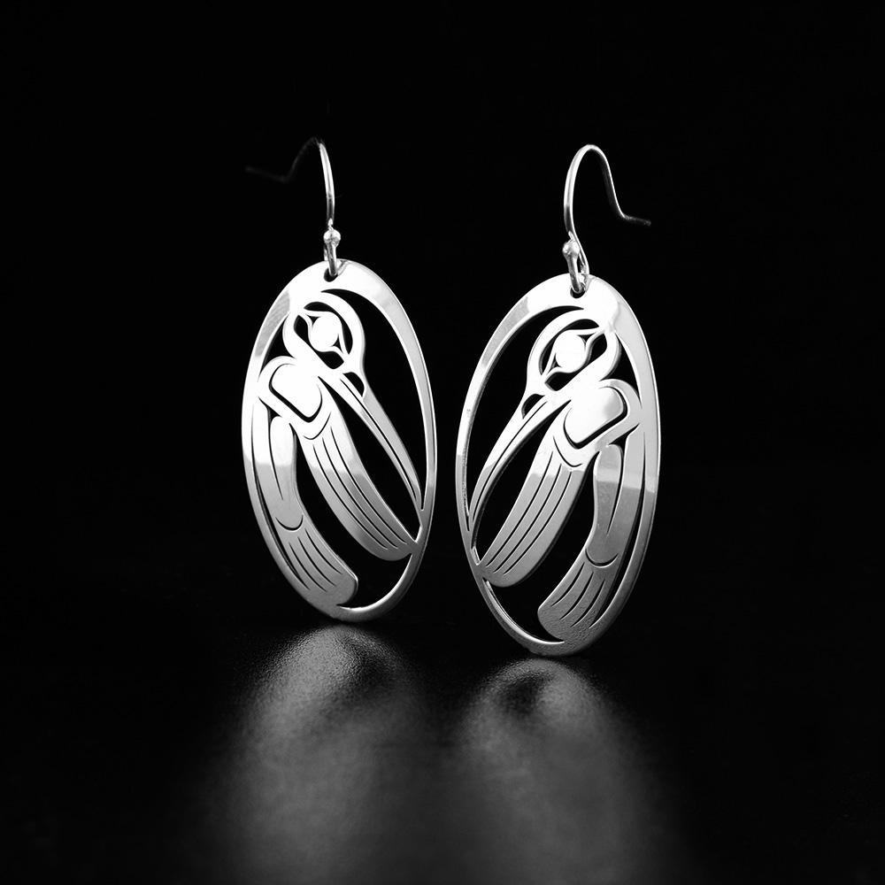 These Hummingbird earrings are made form sterling silver and have oval shaped hangs. There are cutout designs on the surface of the hangs that depict the Hummingbird.